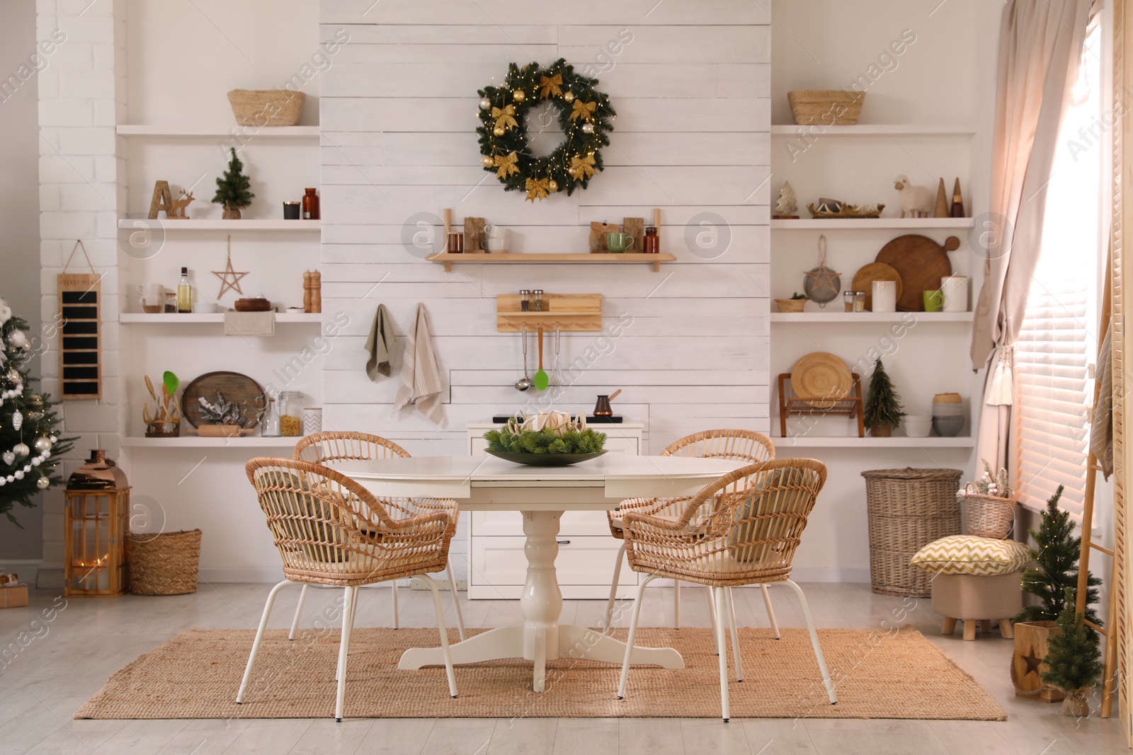 Photo of Cozy dining room interior with Christmas tree and festive decor