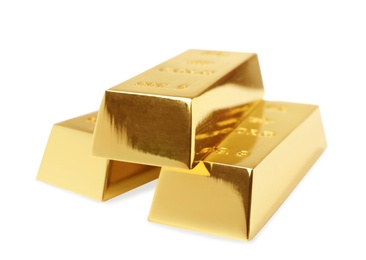 Photo of Precious shiny gold bars on white background