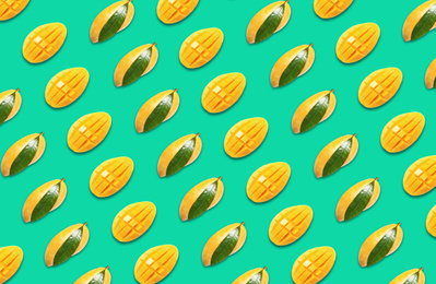 Image of Pattern of whole and cut mango fruits on turquoise background