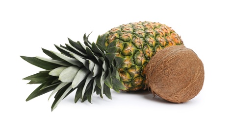 Tasty raw pineapple and coconut on white background