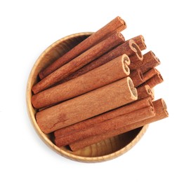 Photo of Aromatic cinnamon sticks in bowl isolated on white, top view