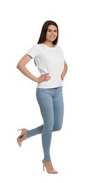 Happy woman wearing stylish light blue jeans and high heels shoes on white background