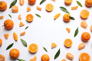 Photo of Frame made of fresh ripe and space for text on white background, top view. Citrus fruit