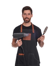 Photo of Professional hairdresser holding brush and dryer on white background