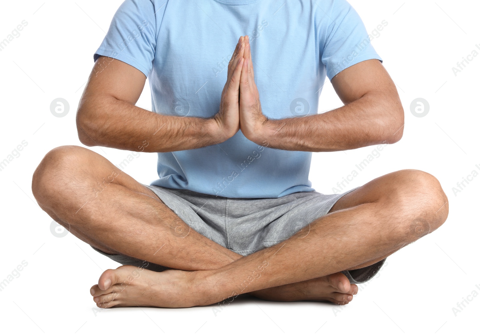 Photo of Man meditating on white background, closeup. Harmony and zen