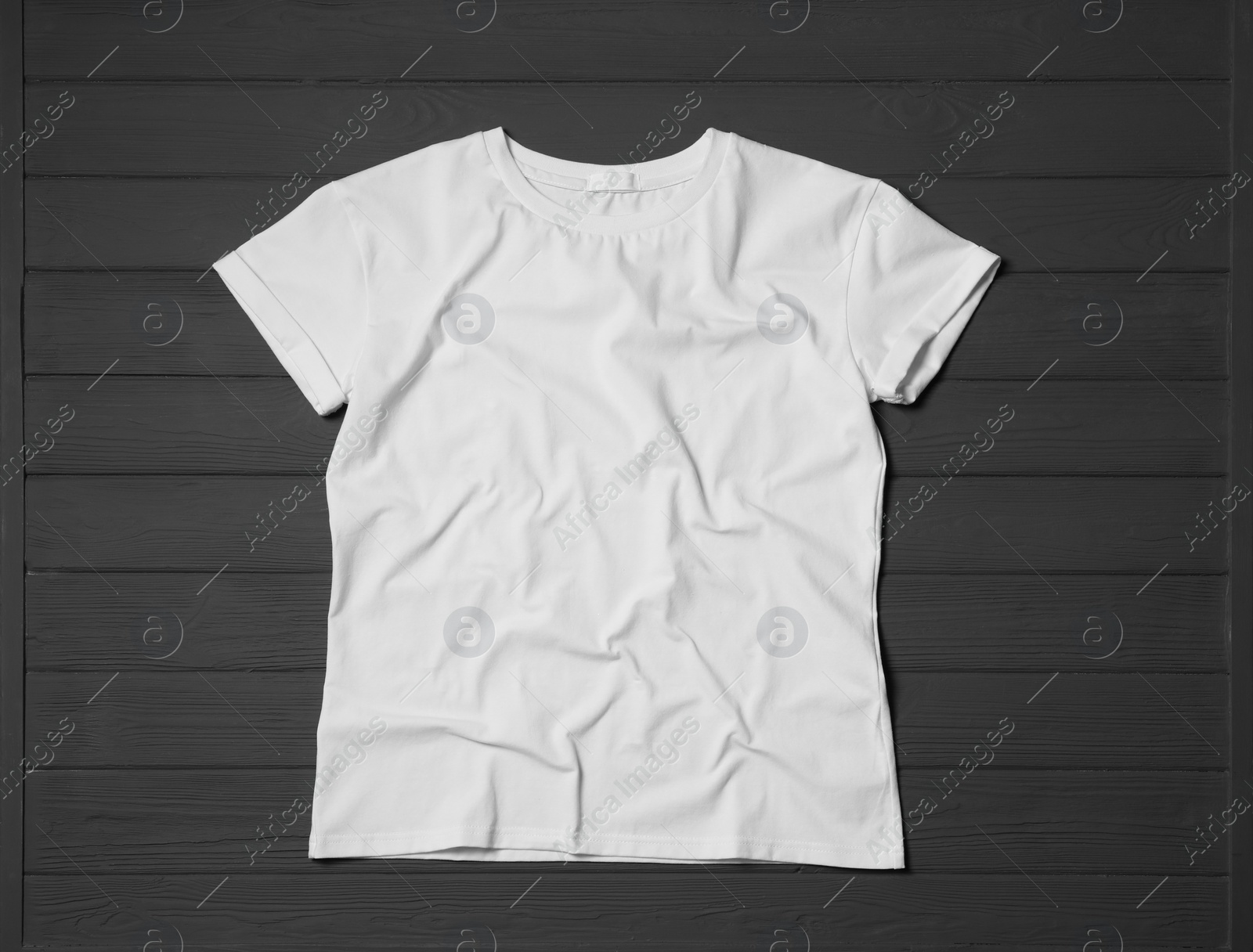 Photo of Stylish white T-shirt on gray wooden table, top view