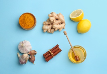 Photo of Flat lay composition with different natural antibiotics on light blue background