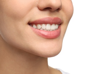 Photo of Woman with healthy teeth and beautiful smile on white background, closeup. Cosmetic dentistry