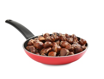 Photo of Delicious sweet roasted edible chestnuts in frying pan isolated on white