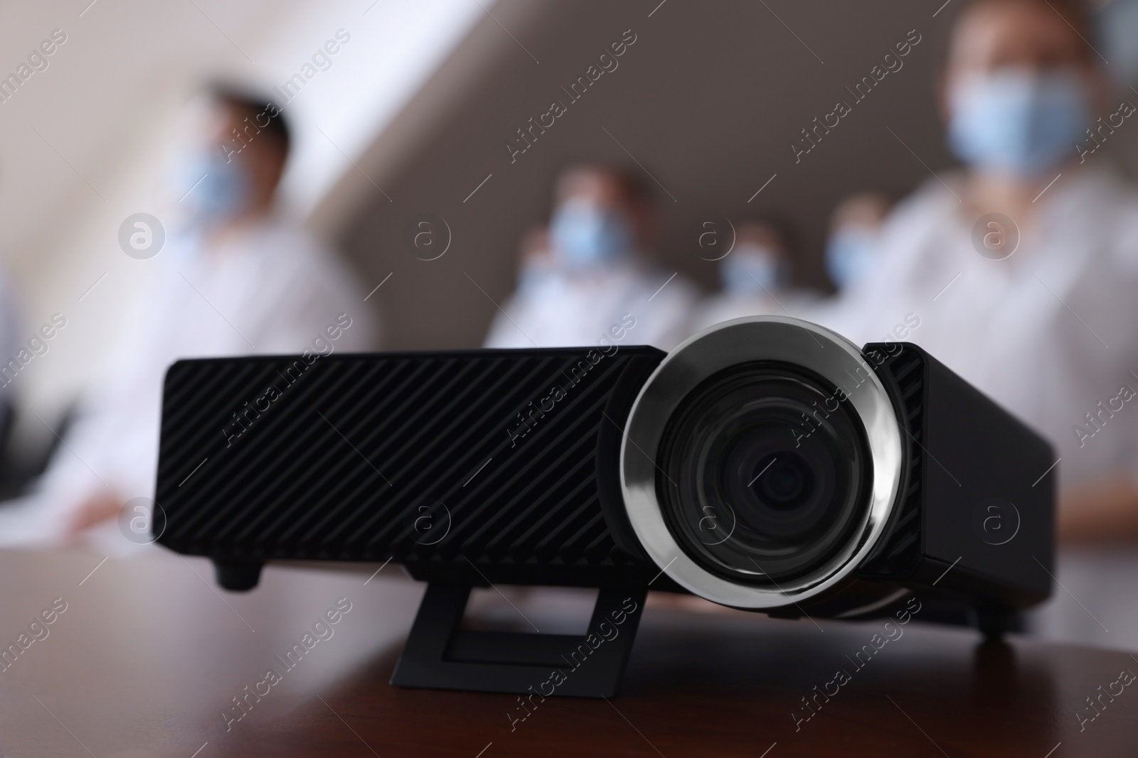 Photo of Video projector on table during medical conference