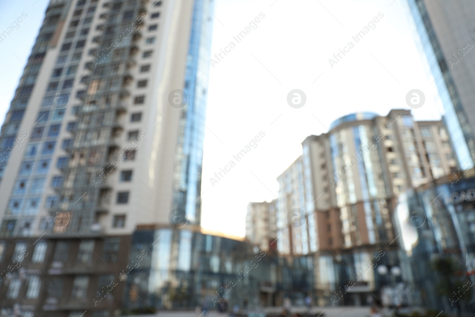 Photo of Blurred view of modern buildings with windows. Urban architecture