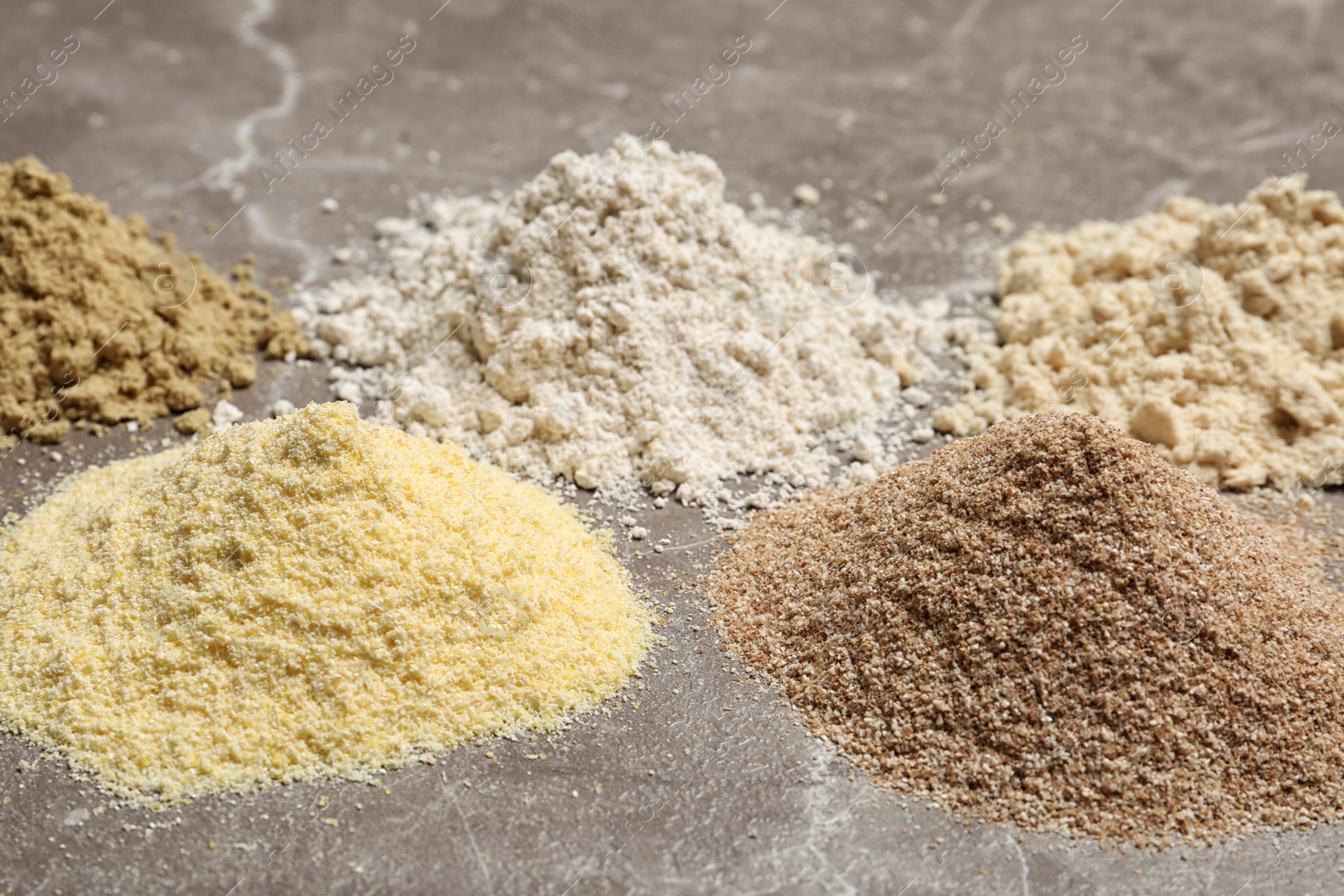 Photo of Piles of different flour types on table