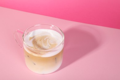 Photo of Cup of fresh coffee on pink background. Space for text