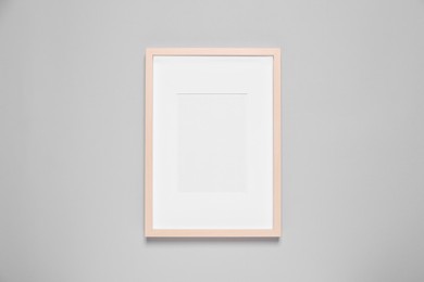 Photo of Empty photo frame on light background, top view. Space for design