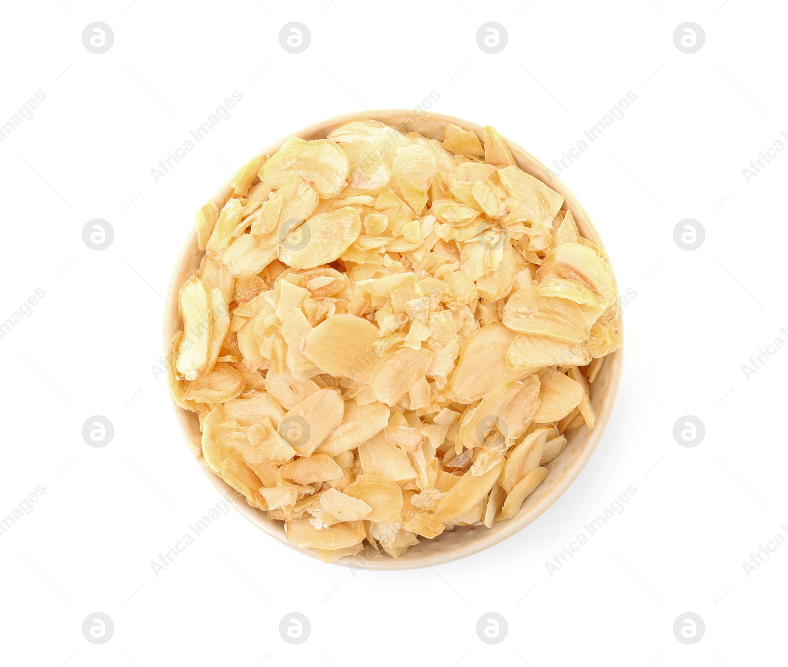 Photo of Dried garlic flakes in bowl on white background, top view