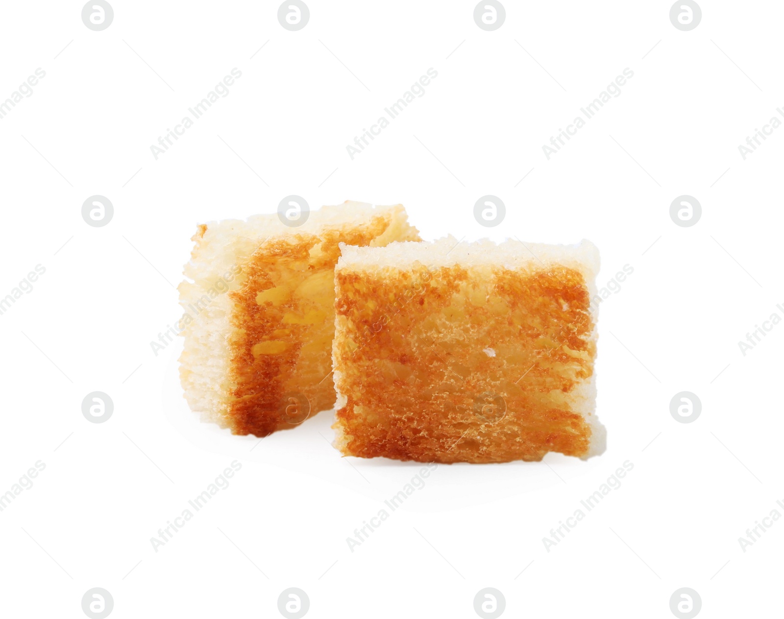 Photo of Two delicious crispy croutons on white background