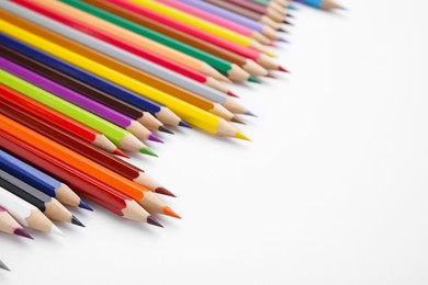 Colorful wooden pencils on white background, space for text