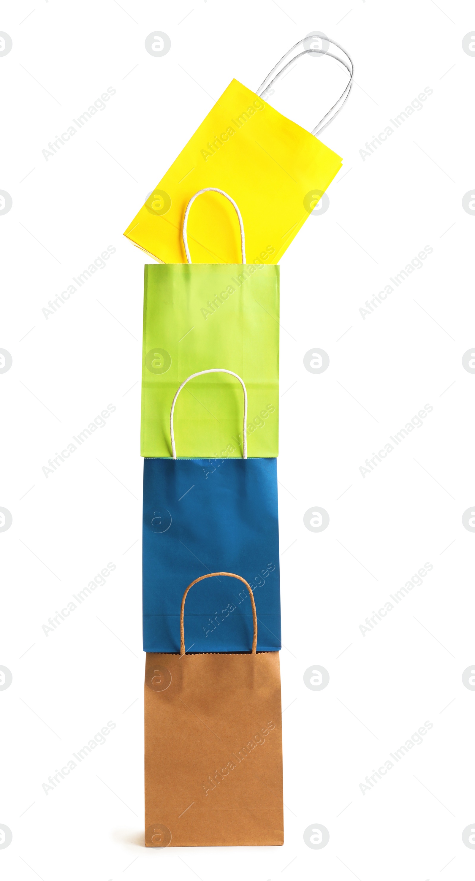 Photo of Colorful paper shopping bags on white background