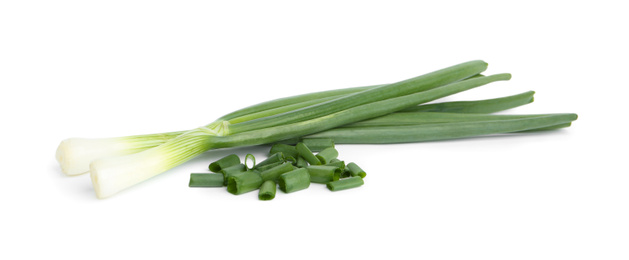 Photo of Fresh green spring onions isolated on white