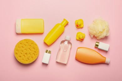 Flat lay composition with baby cosmetic products on pink background