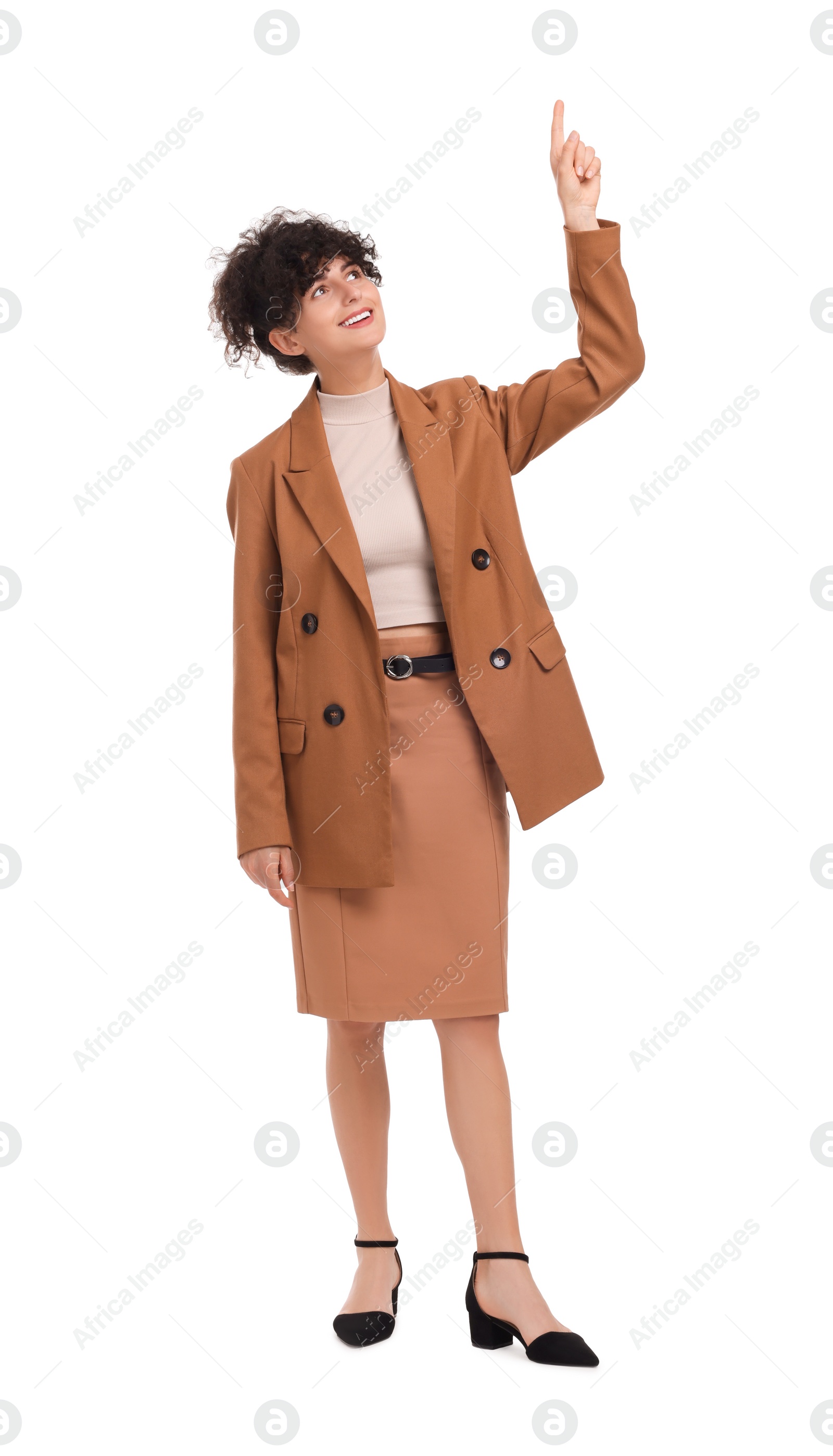 Photo of Beautiful businesswoman pointing at something on white background