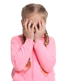 Photo of Girl covering face with hands on white background. Children's bullying
