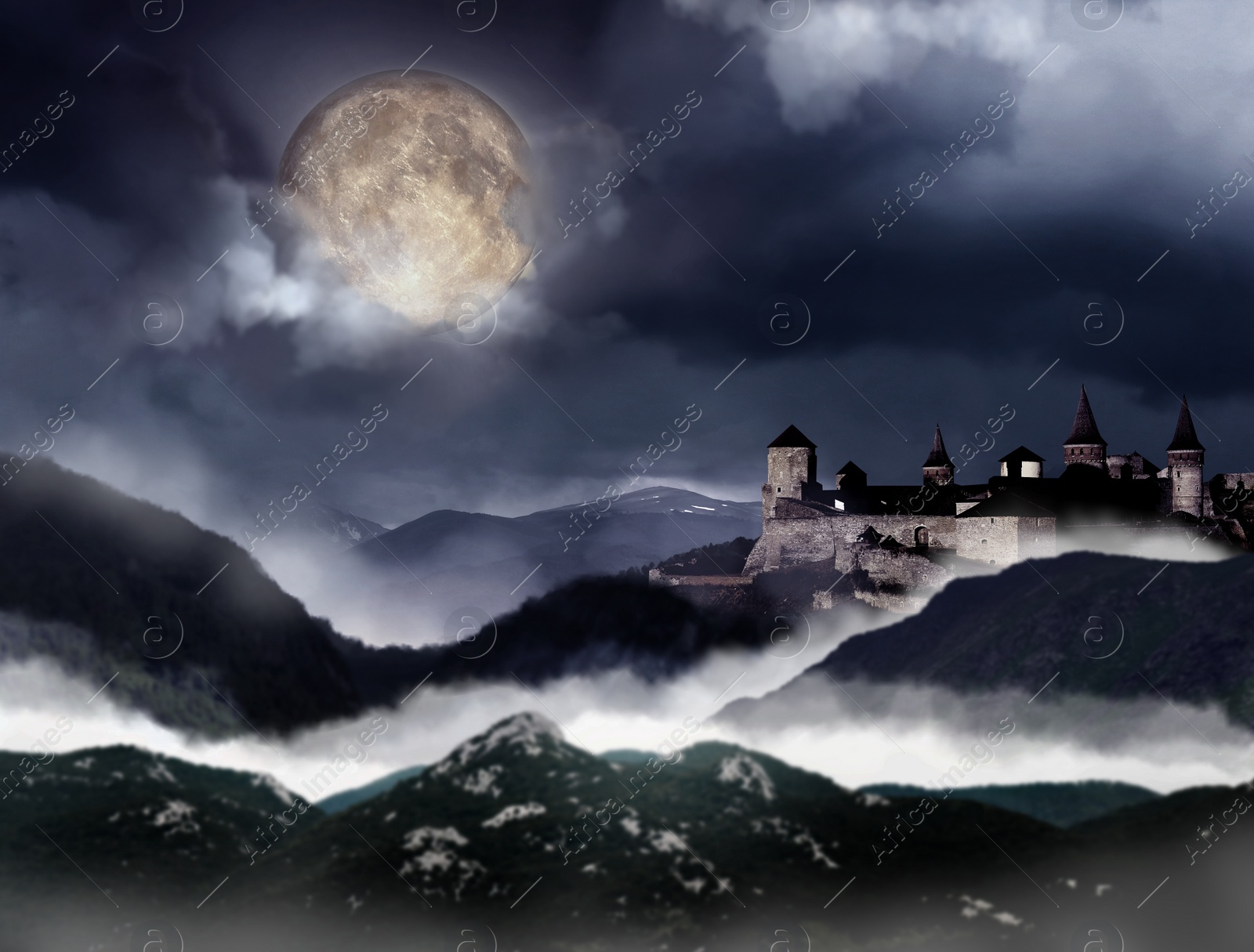 Image of Fantasy world. Mystical castle and mountains covering with fog in night