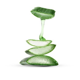 Image of Aloe vera gel flowing down from green leaf section on white background