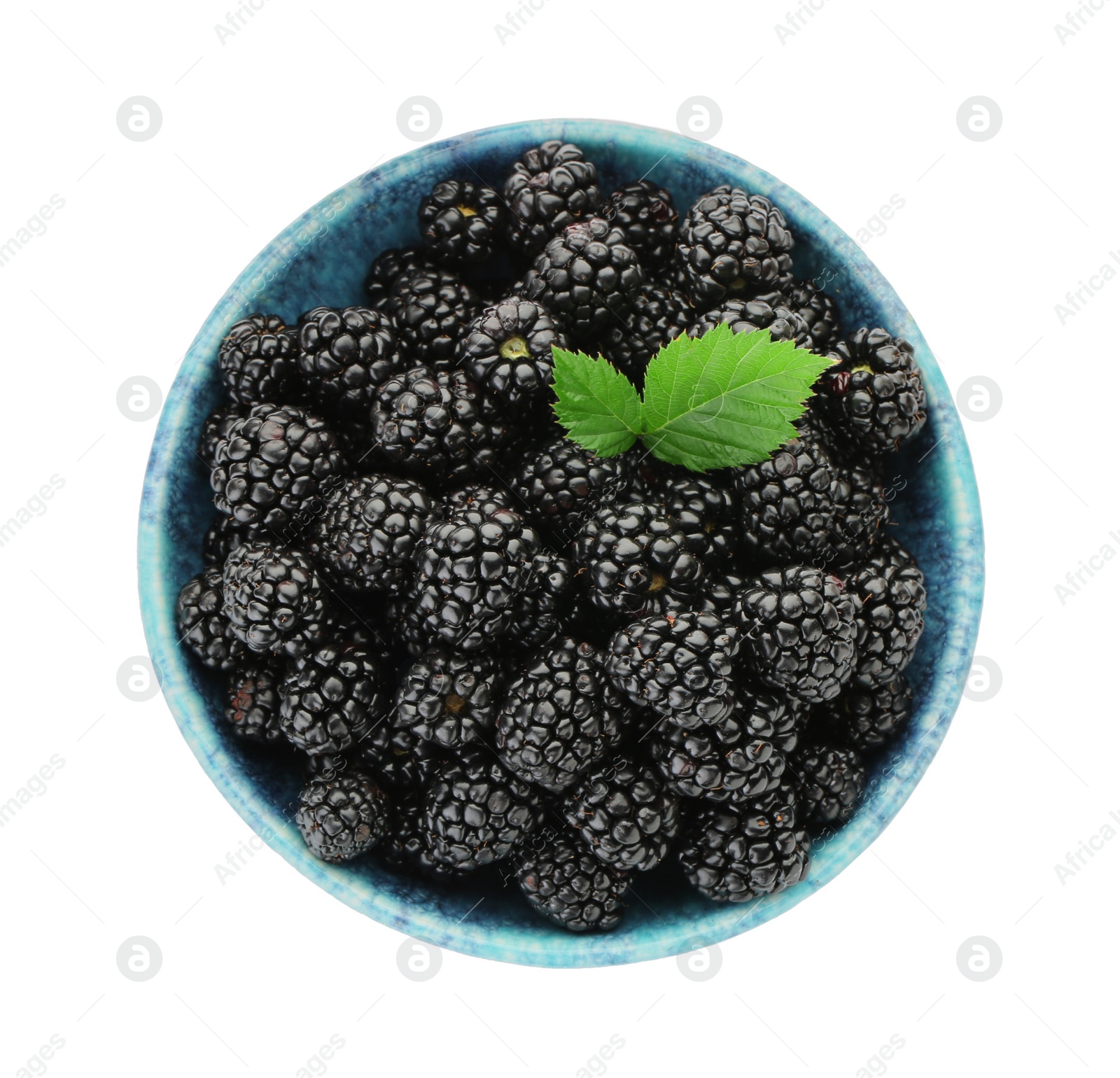 Photo of Tasty ripe blackberries in bowl isolated on white, top view