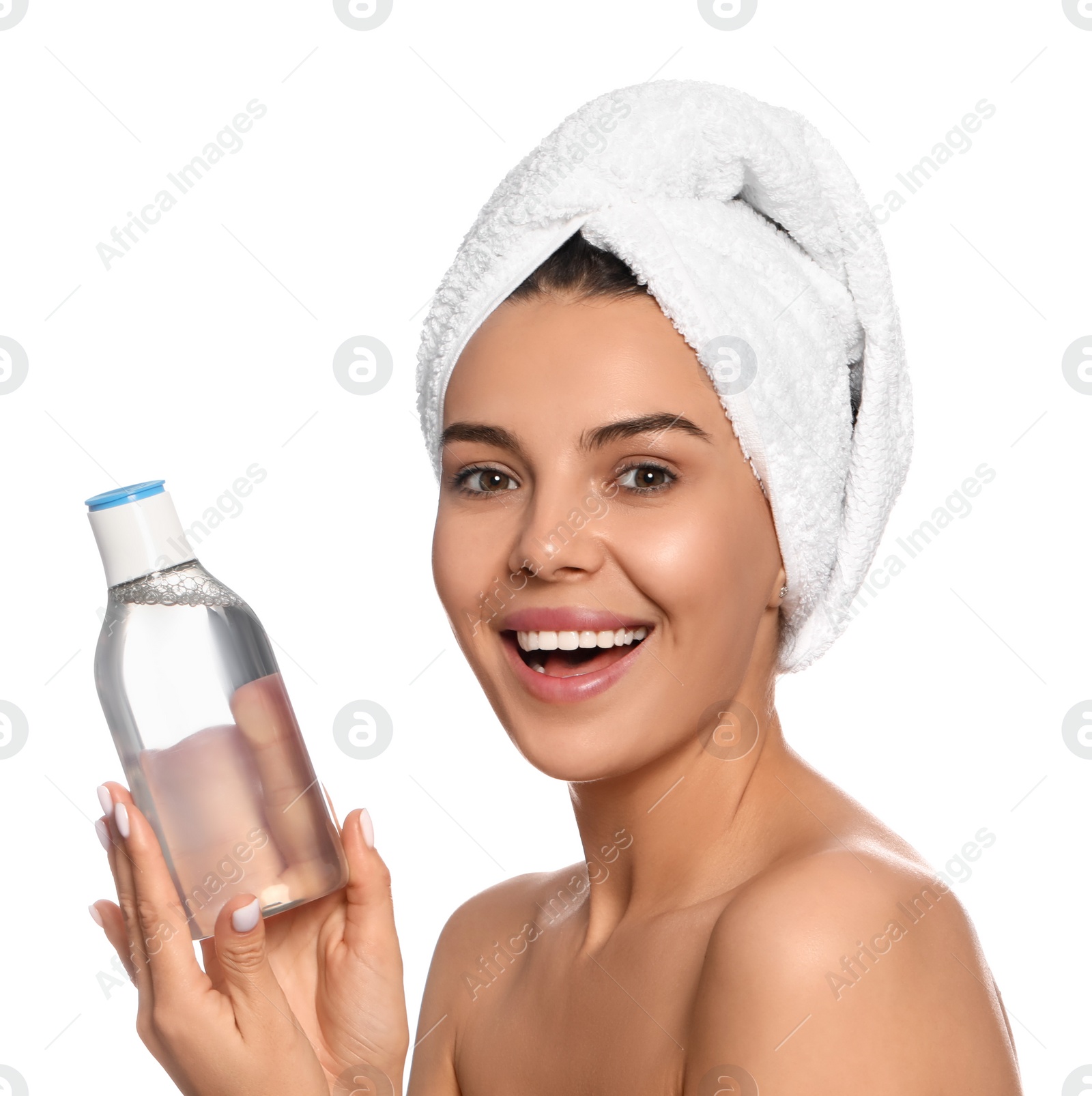 Photo of Young woman with bottle of micellar water on white background