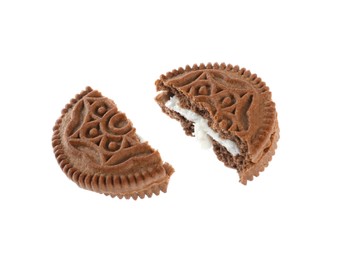 Photo of Broken tasty chocolate sandwich cookie with cream on white background