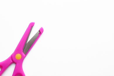 Photo of Pair of training scissors on white background