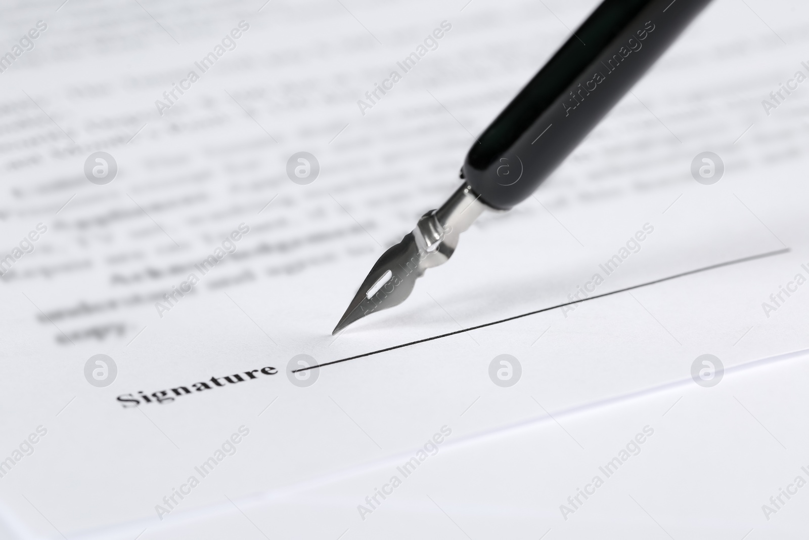 Photo of Signing notary document with fountain pen, closeup. Space for text