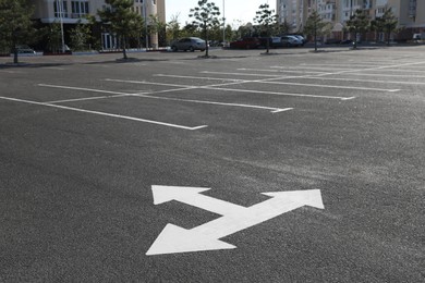 Car parking lot with white marking outdoors