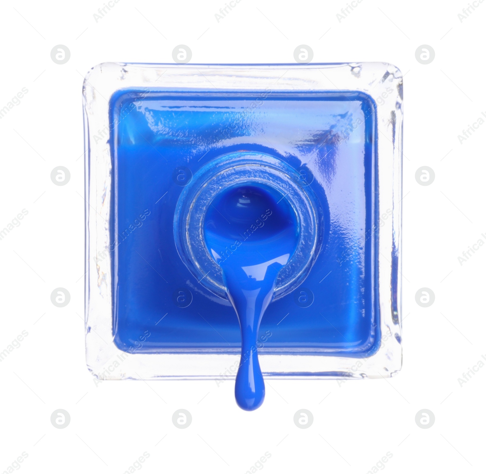 Photo of Blue nail polish dripping from bottle isolated on white