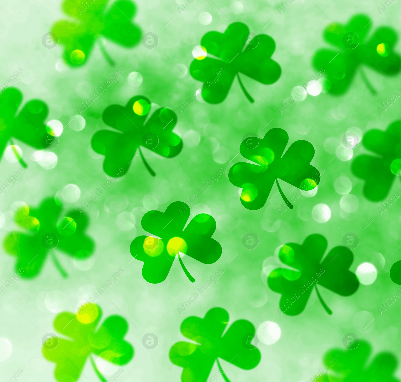 Image of St. Patrick's Day celebration. Clover leaves on green background, bokeh effect