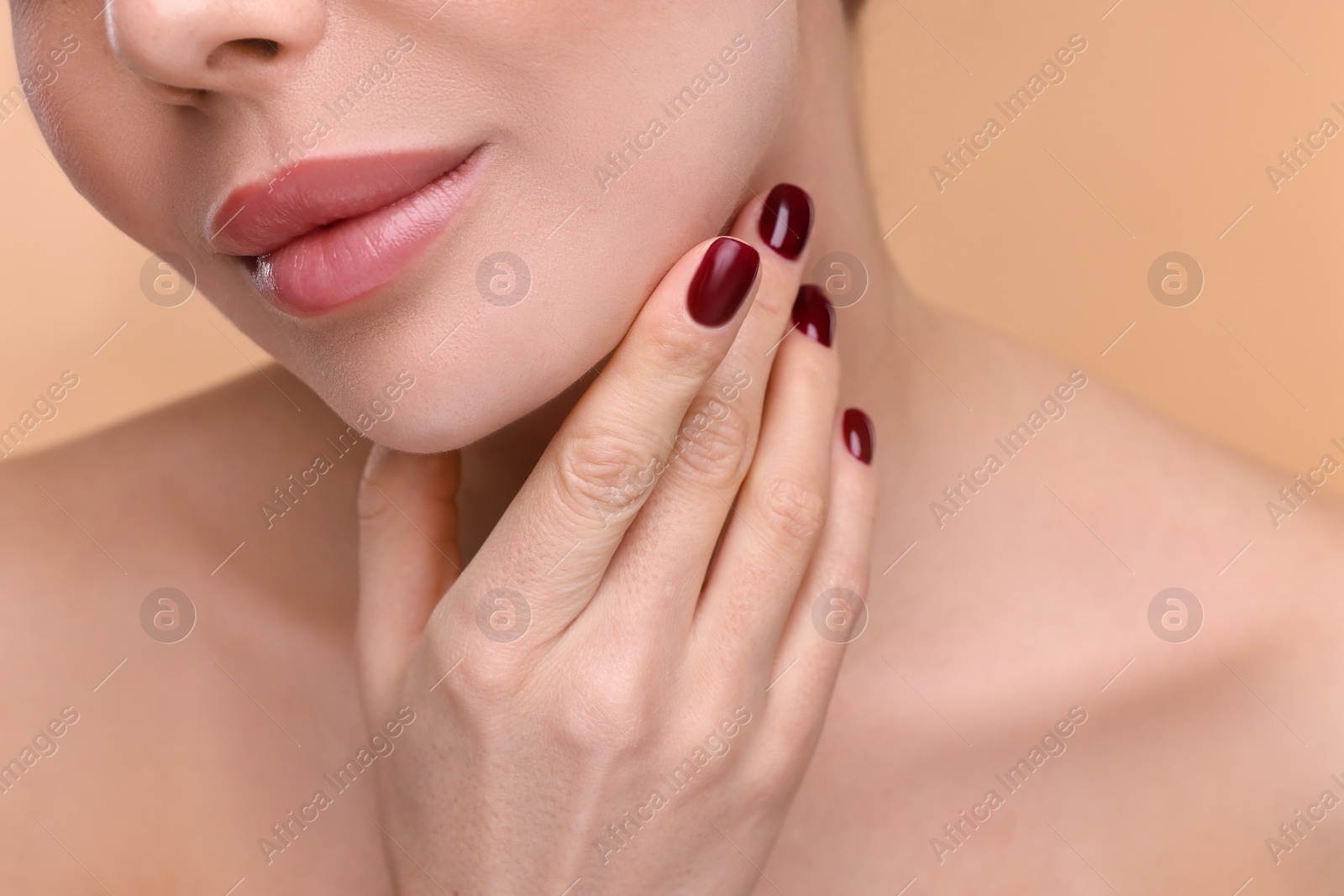 Photo of Woman with beautiful lips on beige background, closeup