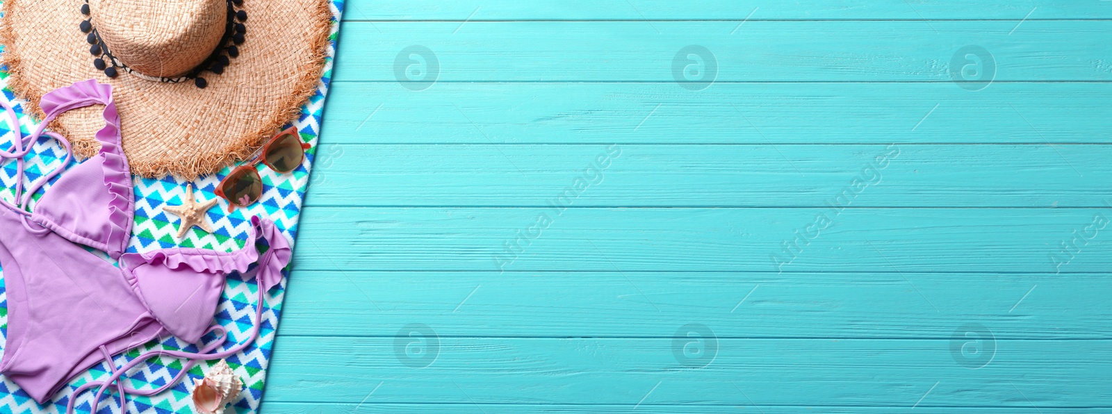 Image of Flat lay composition with beach accessories on blue wooden background, space for text. Banner design