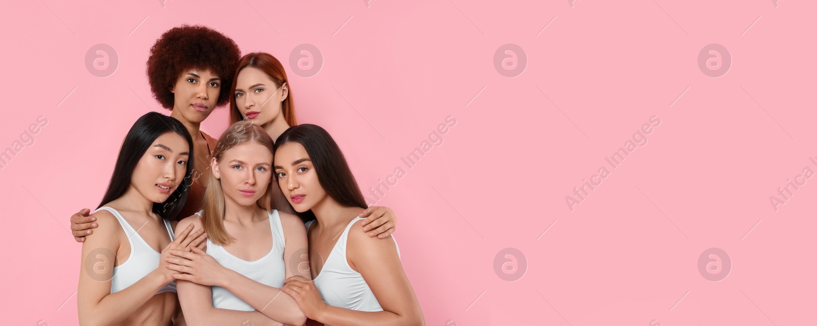 Image of Portrait of beautiful young women on pink background. Banner design with space for text