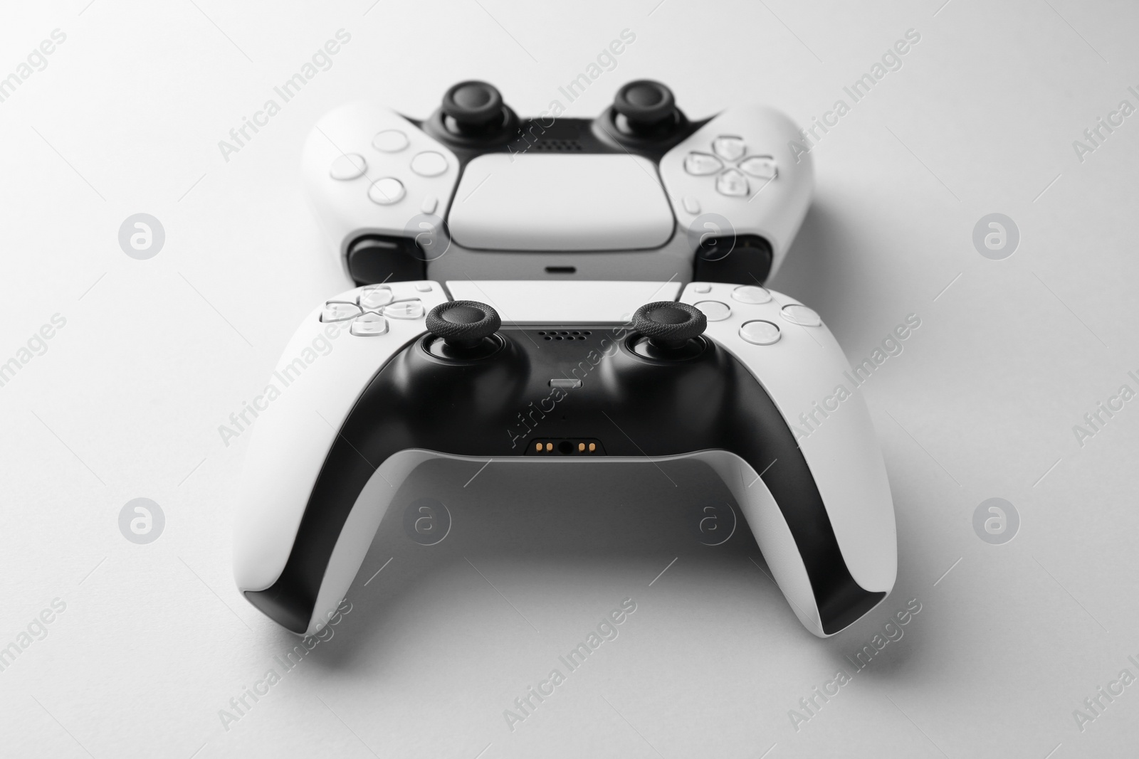 Photo of Wireless game controllers on light grey background