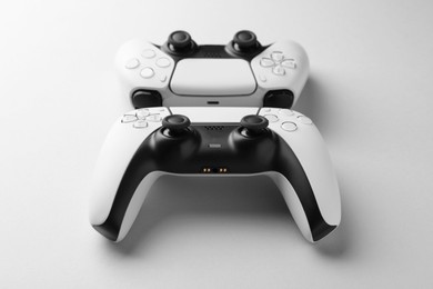 Wireless game controllers on light grey background