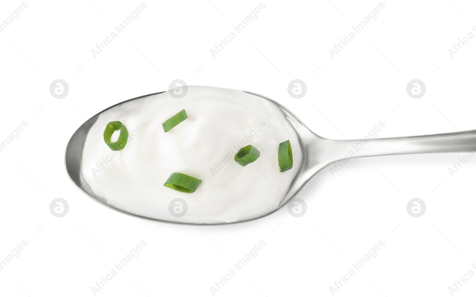 Photo of Delicious sour cream with onion in spoon on white background, top view