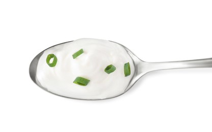 Photo of Delicious sour cream with onion in spoon on white background, top view