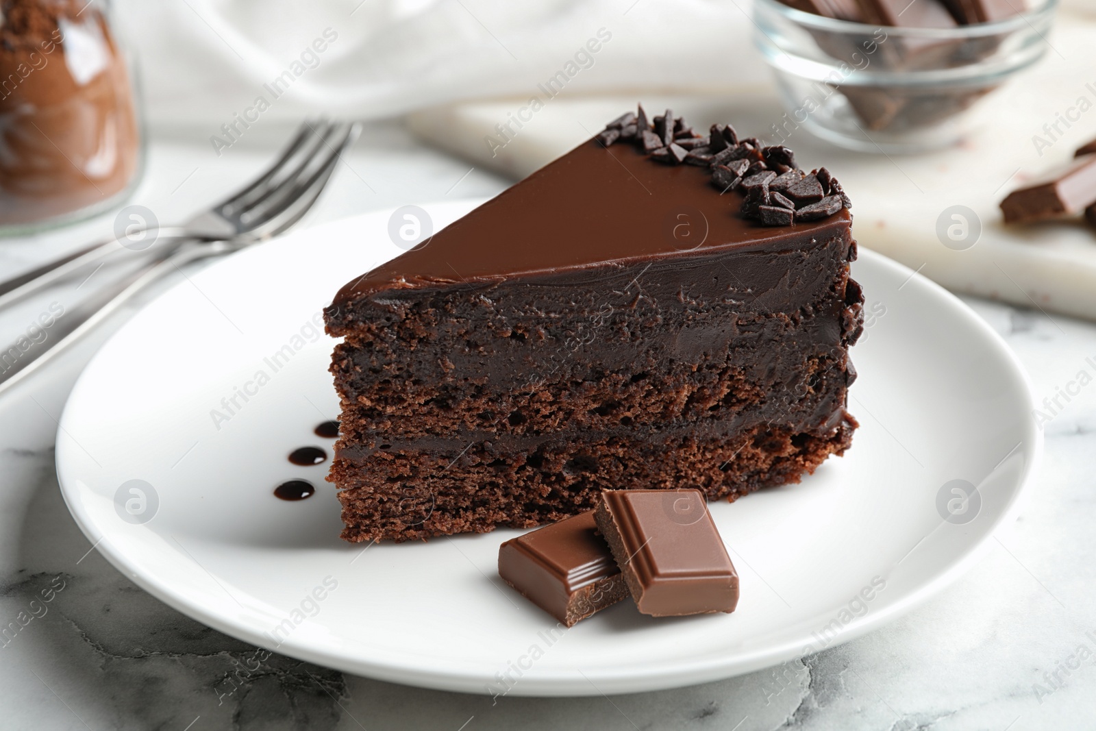 Photo of Delicious fresh chocolate cake served on white marble table