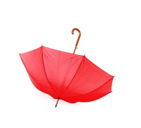 Photo of Modern opened red umbrella isolated on white