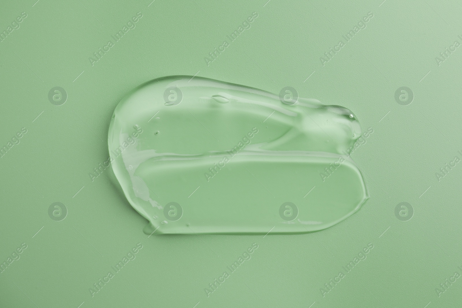 Photo of Sample of gel on green background, top view