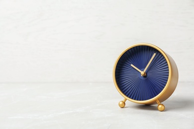 Photo of Modern clock on light background. Time management