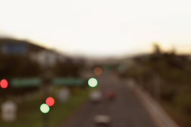 Photo of Blurred view of highway in city at evening