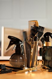 Set of hairdresser tools on table in salon