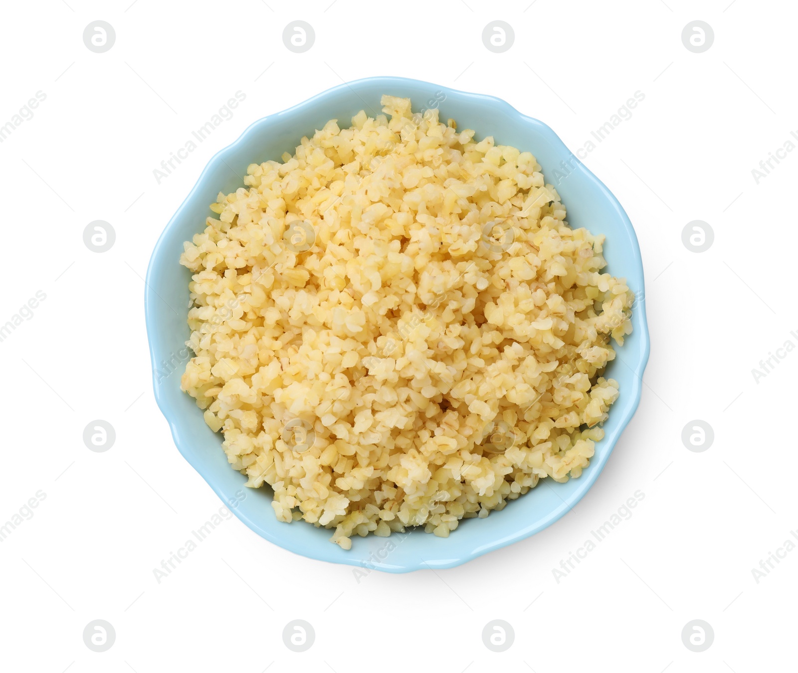 Photo of Delicious bulgur in bowl isolated on white, top view